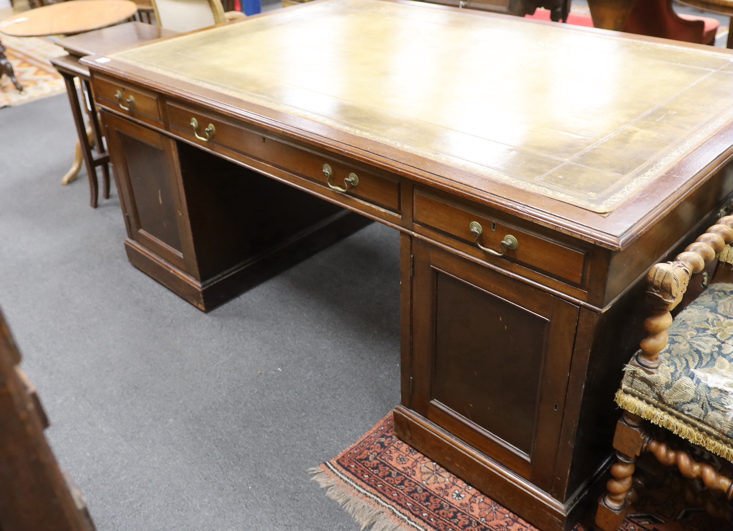 An early 20th century mahogany pedestal partner's desk, length 184cm, depth 120cm, height 77cm
